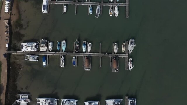 Aerial birds eye footage of Yachts and Boats moored at Thornham Marina near Emsworth in Southern England.