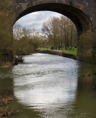 Fototapeta na wymiar Arch of the Haversham Viaduct as it crosses the River Ouse