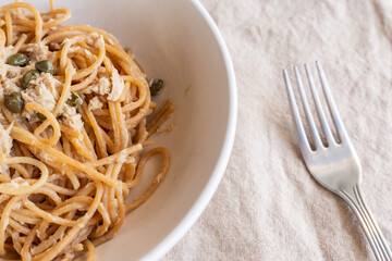 Spaghetti with tuna and capers. Typical Italian pasta dish with tuna.