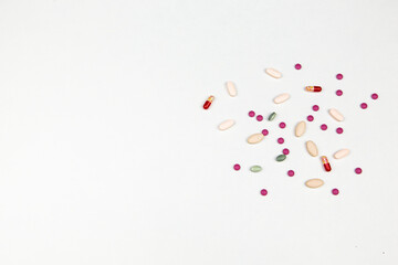 medicines in the form of tablets capsules on a white background top view