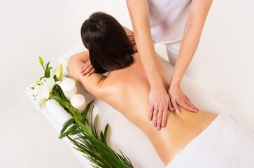 Back massage in the spa salon. Female body massage