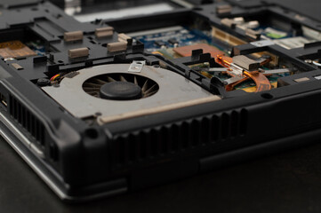 Blurred image of the details of a disassembled laptop.