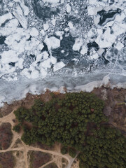 Nice view of frozen ice with forest. Drone photo