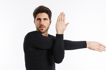 Young athletic sportsman doing exercise while working out