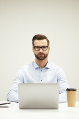 Smart handsome IT specialist at his workplace