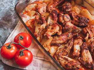 Sticky BBQ chicken wings on a baking sheet
