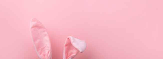 pink rabbit ears over pink background, minimal easter background, panoramic mock-up