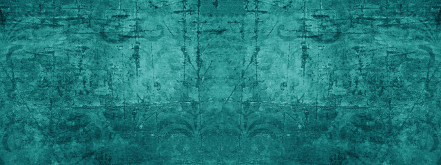 Old turquoise green vintage worn shabby patchwork motif tiles stone concrete cement wall texture background banner