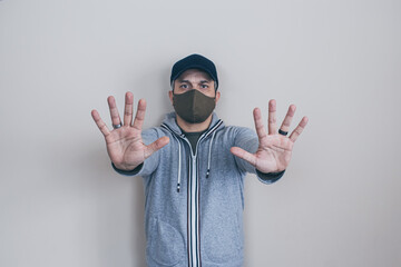 man with mask stop hands