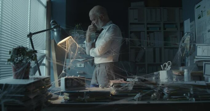 Depressed businessman in the abandoned office