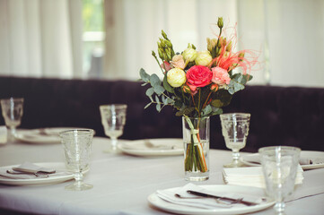 Luxurious floral arrangement of pink and white flowers fixed on the wall