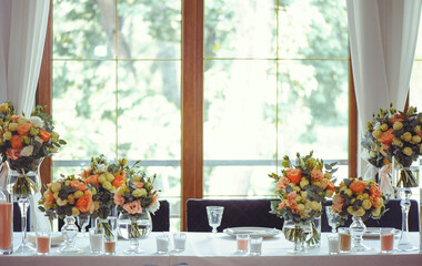 Luxurious floral arrangement of pink and white flowers fixed on the wall