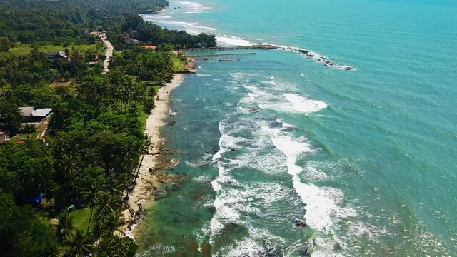 Aerial drone view of Beach and Its Wonderful Sunset View. At anyer beach with noise cloud. Banten, Indonesia, March 3, 2021
