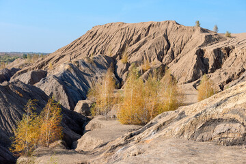 Konduki, Tula region, Romancevskie mountains, Abandoned Ushakov quarries. The mud erosion of the soil looks like mountains. The area is overgrown with young birches. Beautiful natural landscape