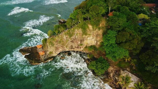Aerial drone view of Beach and Its Wonderful Sunset View. At anyer beach with noise cloud. Banten, Indonesia, March 3, 2021
