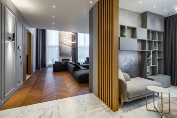Modern interior of luxury private house. Grey tones. Wooden design.