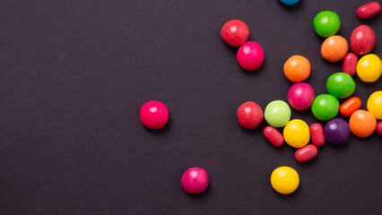 colorful little candies on a colored background