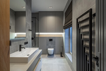 Modern interior in grey tones of bathroom in luxury apartment.