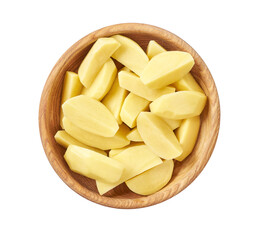 slices of raw potatoes in wooden bowl isolated on white background.