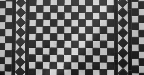 View of black and white tiled chequered Victorian floor from above
