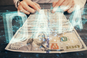 Double exposure of technology drawing hologram and us dollars bills and man hands. Data concept