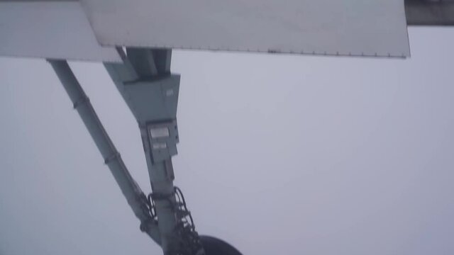 Airplane landing gear down deploy flying in dense fog zero visibility instrument flight approach for landing. Aviation industry