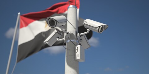 Naklejka na ściany i meble Security cameras near flag of Egypt, 3d rendering