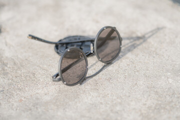 Steampunk sunglasses with big round lens shoot outside in a sunny day closeup. Selective Focus. High quality photo