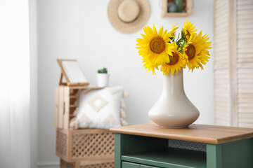 Bouquet of beautiful sunflowers on table indoors. Space for text