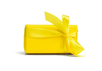 rectangular box with a gift wrapped in yellow paper and tied with a silk yellow ribbon
