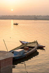 Varanasi / India 27 March 2018 Beautiful view of sunrise with boats at Ganga (Ganges) river in...