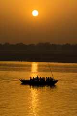 Varanasi / India 26 March 2018 Early morning sunrise over the Ganges at Varanasi Ghat in Uttar...