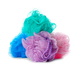Set with new shower puffs on white background