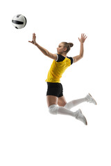 Flying. Young female volleyball player isolated on white studio background. Woman in sportswear...