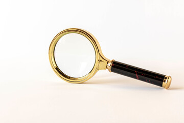 Magnifying glass on a light background. The concept of information search. Selective focus.