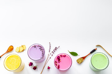 Colorful super latte coffee or tea with turmeric, beetroot and matcha