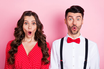 Portrait of nice excited crazy brown hair couple she wear dress he shirt isolated on pastel pink color background