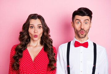 Portrait of nice impressed brown hair couple she wear dress he shirt isolated on pastel pink color background