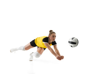 Catching. Young female volleyball player isolated on white studio background. Woman in sportswear...