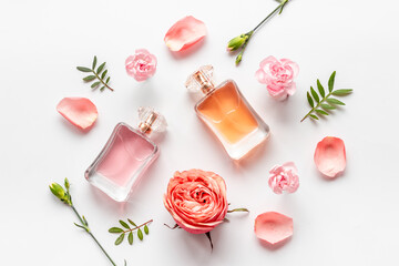 Perfume bottle with peonies and roses flowers