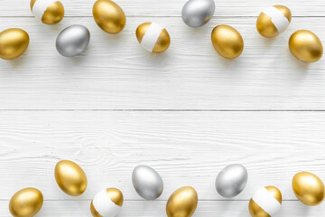 Flat lay of golden and silver eggs. Good luck symbol. Easter decoration