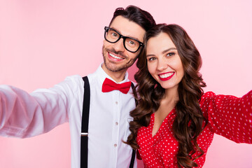 Photo of nice optimistic brown hair couple do selfie wear red dress shirt isolated on pastel pink color background