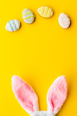 Fototapeta na wymiar Happy Easter background. Bunny ears with eggs cookies, space for text