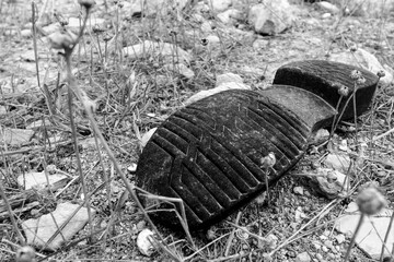 Black rubber shoe sole thrown in the countryside