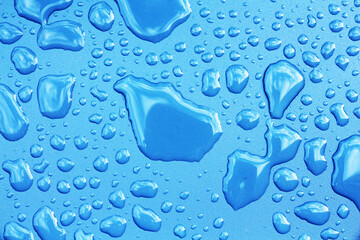 water droplets on metallic blue surface