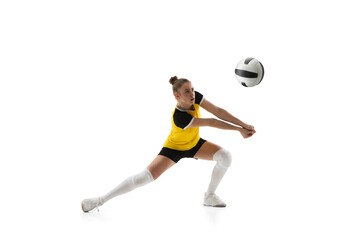 Ready. Young female volleyball player isolated on white studio background. Woman in sportswear training and practicing in action, flight. Concept of sport, healthy lifestyle, motion and movement. © master1305