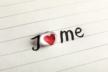 Phrase I Love Me written on paper, closeup view