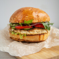 burger with fish and vegetables in parchment