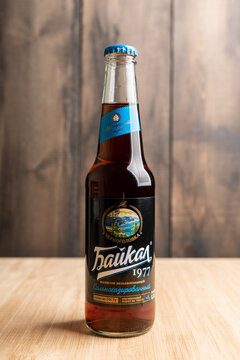 Novosibirsk, Russia - March 01, 2021: Bottle of Baikal drink on the rustic wooden background.