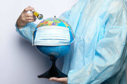 The doctor gives an injection to the globe